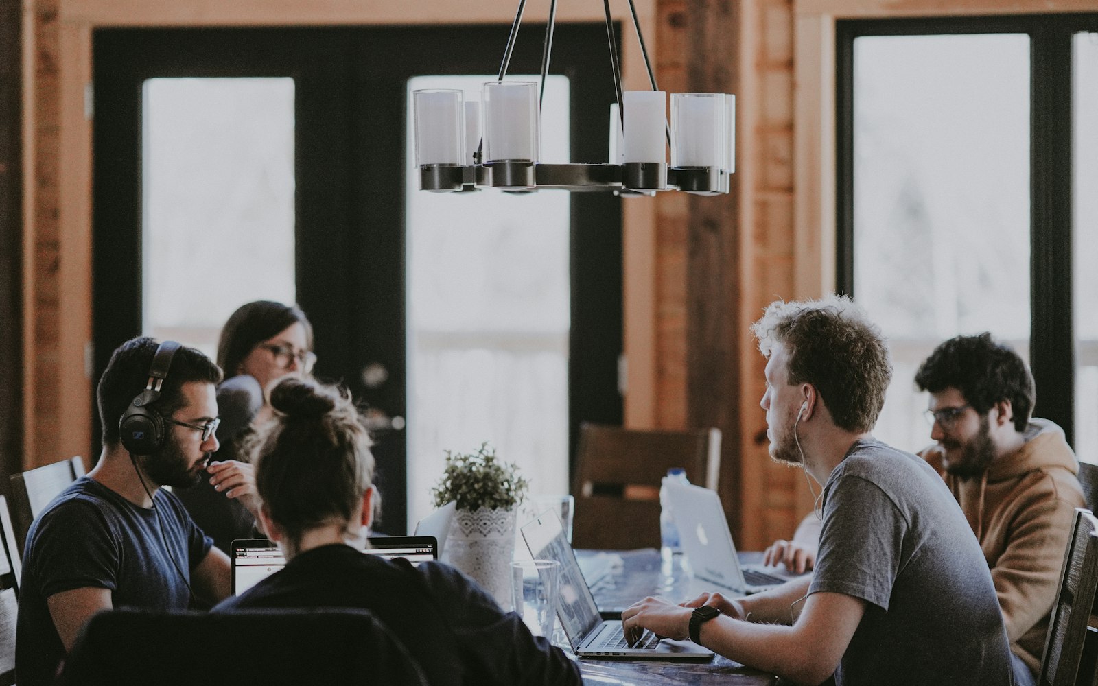 A team gathered for a discussion in a modern workplace
