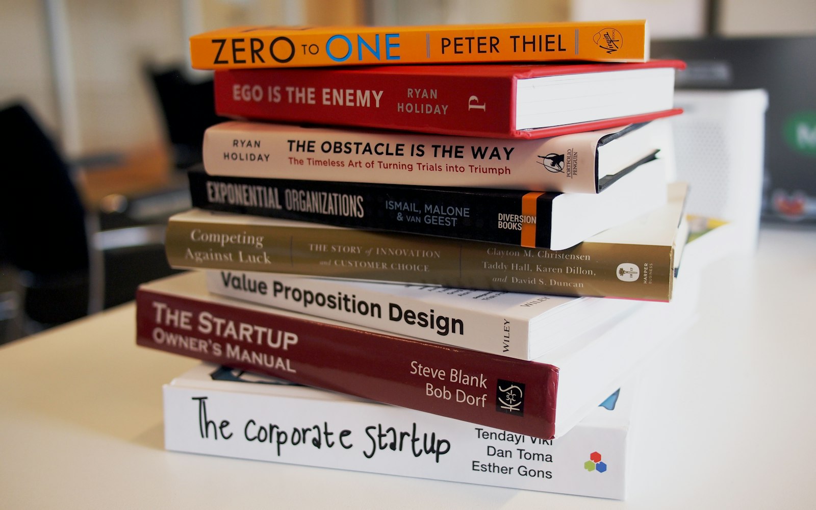 A stack of design and business books on display